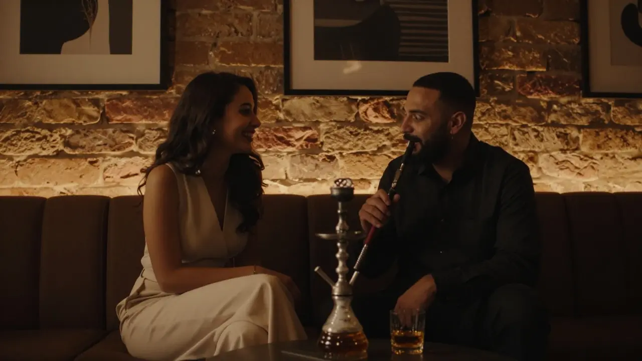 A quiet moment in an art lounge in Dubai, sharing shisha under soft amber lighting.