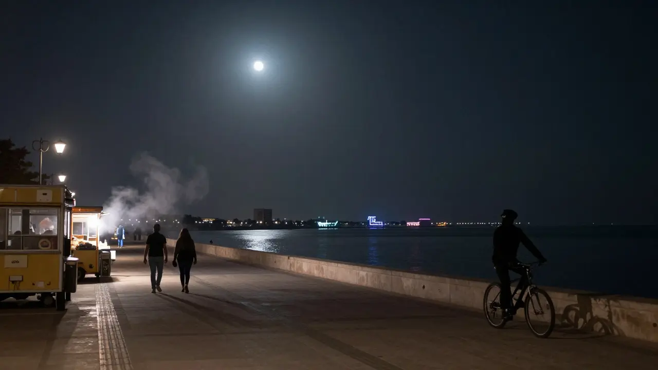 The peaceful Corniche promenade at midnight in Abu Dhabi, with couples strolling under soft lanterns.