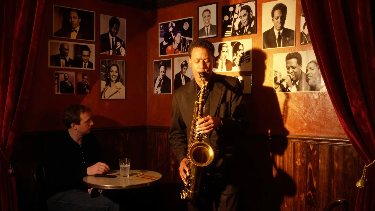 A saxophonist plays in the dim, intimate glow of The Jazz Cafe, walls lined with jazz legends' photos.