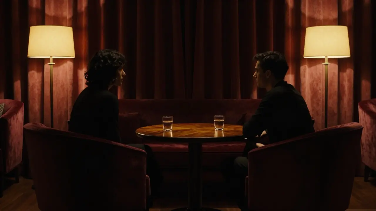 Silhouettes talking in dimly lit private lounge with velvet chairs.
