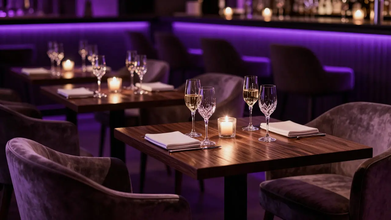 Upscale champagne bar interior with velvet seats and crystal glasses glowing.